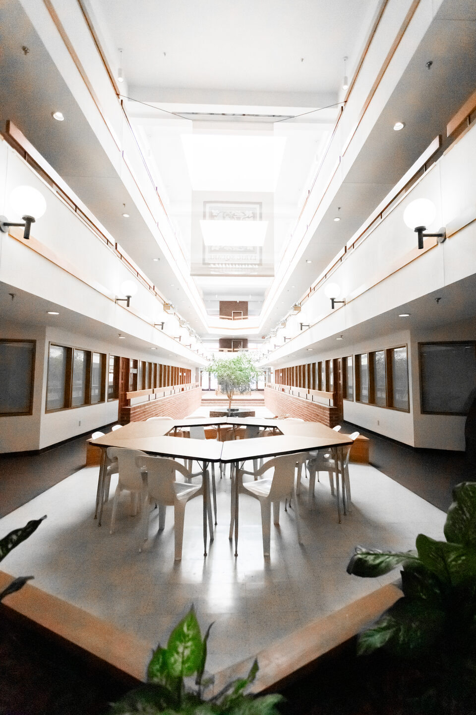 Shared meeting space under the skylit atrium at Lyric Square, Anniston, Alabama